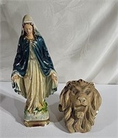 Statue of Mary and a lion head