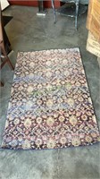 Nice multicolored area rug measures 63 x 39   1939