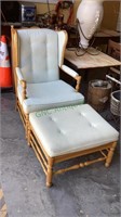 Matching padded wooden arm chair and ottoman