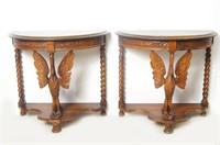 Pair of Walnut Demi-Lune tables with Carved Swans