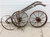 Old wheeled hoe and iron wheels