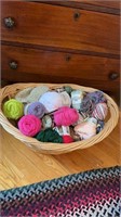 Laundry basket filled with skeins of yard ,