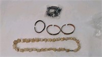 Copper bracelets and stone necklaces