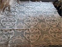 Square lace tablecloth has a spot
