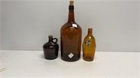 (3) vintage amber bottles, tallest is 15.25’’ and