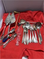 SILVER-PLATE DINING UTENSILS AND 2 CANDLE