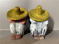 Two Resting Cement Statuettes