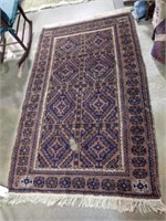RED NATIVE PATTERN RUG - SOME DAMAGE 76x45