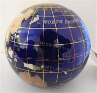 Figural world globe glass paperweight