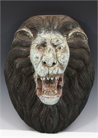 CARVED FOLK ART ORNAMENT OF A LION HEAD