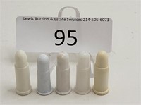 5 White Plastic LECO & Unmarked Toy Bullets
