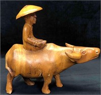 Wooden Sculpture Of Man Riding Oxen To/From The Fi