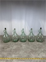 Vintage green glass gallon jugs, set of 5