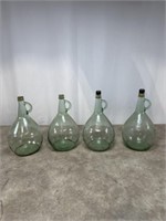 Vintage green glass gallon jugs, set of 4