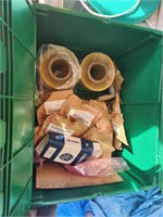 Green tote of plastic film rolls and other items