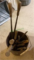 Bucket with tools - hand spades, grass clippers,