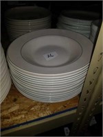 Pile up green rimmed plates