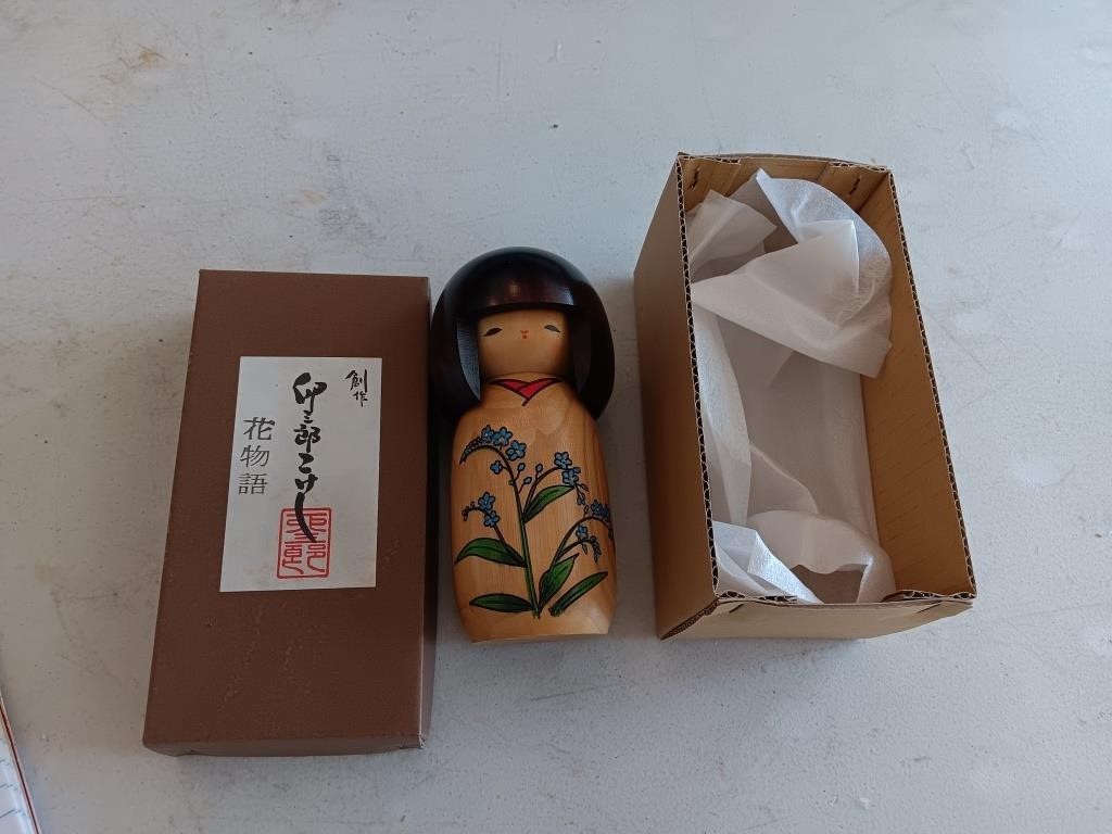 Oriental wooden doll and box.