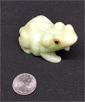 Carved toad out of what appears to be alabaster.