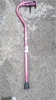 Adjustable pink metal cane