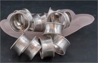 Silver Napkin rings in frosted pink Glass dish