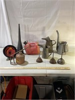 Assorted oil cans, funnels, gas can