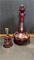 Red decanter and bell/decanter is chipped