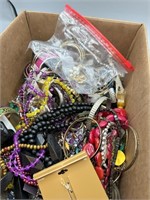 Flat of unsorted jewelry lot