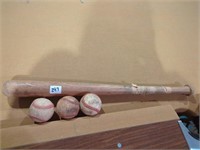 Old wood bat and baseballs