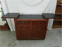 Nice rolling wood bar cabinet with fold out top