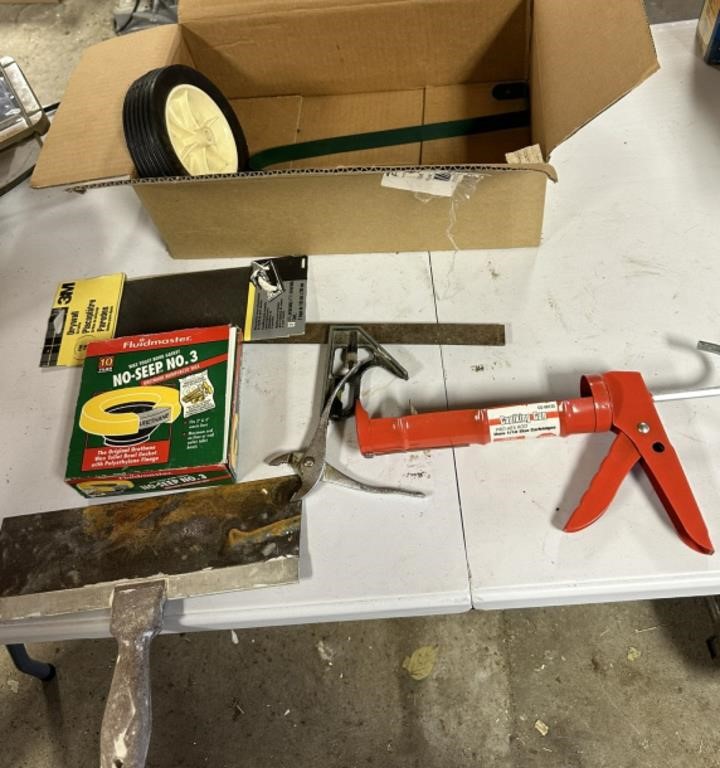 square, caulk gun, drywall sand paper &