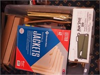 Box of office supplies including file folders,