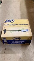 Hand sanitizer dispenser by ZEP. Touch free