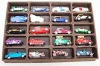 Display case of 20 model cars and trucks