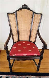 Antique armchair with newer dragonfly
