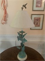 Metal lamp with painted ivy leaves and brass