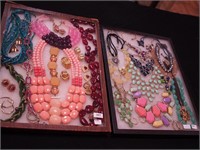 Two containers of costume jewelry: Charming