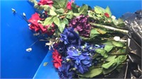 Bag of silk flowers. Red green blue