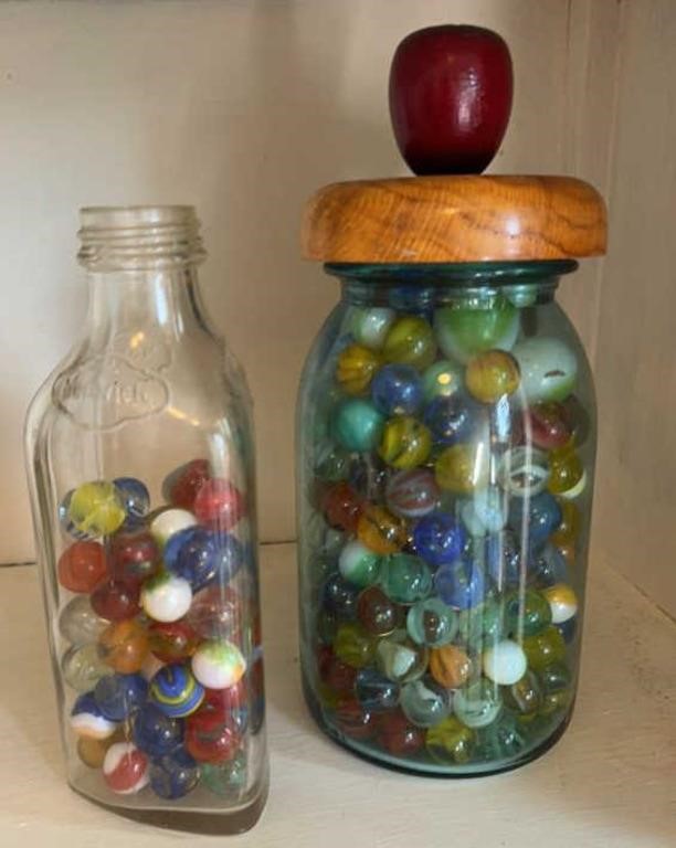 (2) BOTTLES OF MARBLES