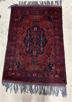 Small Black and Maroon Area Rug