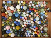 Flat of glass marbles including 26 shooters