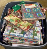 Large plastic bin full of gift boxes - most are