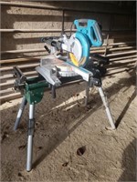 Makita 10" sliding compound miter saw w/stand.