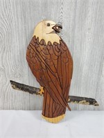 Amazing eagle wood composite sitting on a branch
