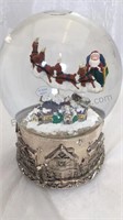 Flying Santa Musical snow globe that plays, “ We