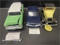 Three plastic models. Includes a 1955 Chevrolet