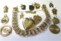 10k gold charm bracelet w. 14 charms, 40 gms, the
