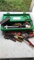 Assorted tools in green box