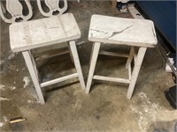 2 wooden saddle bench stools