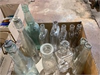 Antique glass flasks and tall bottles